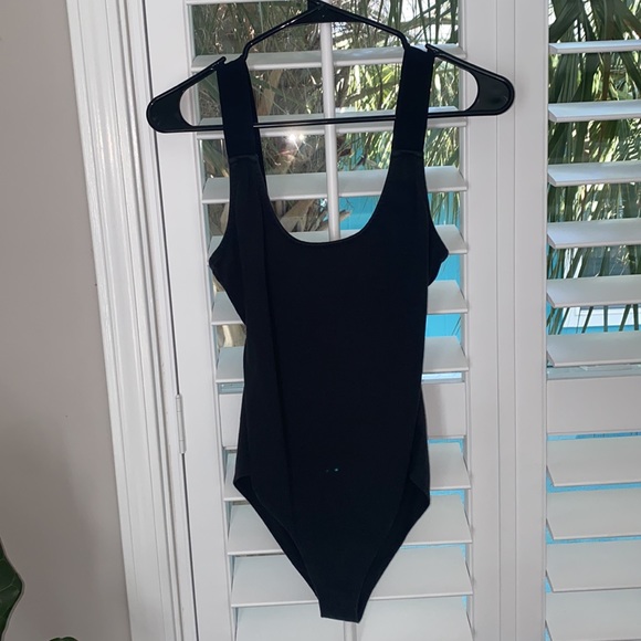 Volcom Tops - Women’s black Volcom bodysuit size small - see the back!